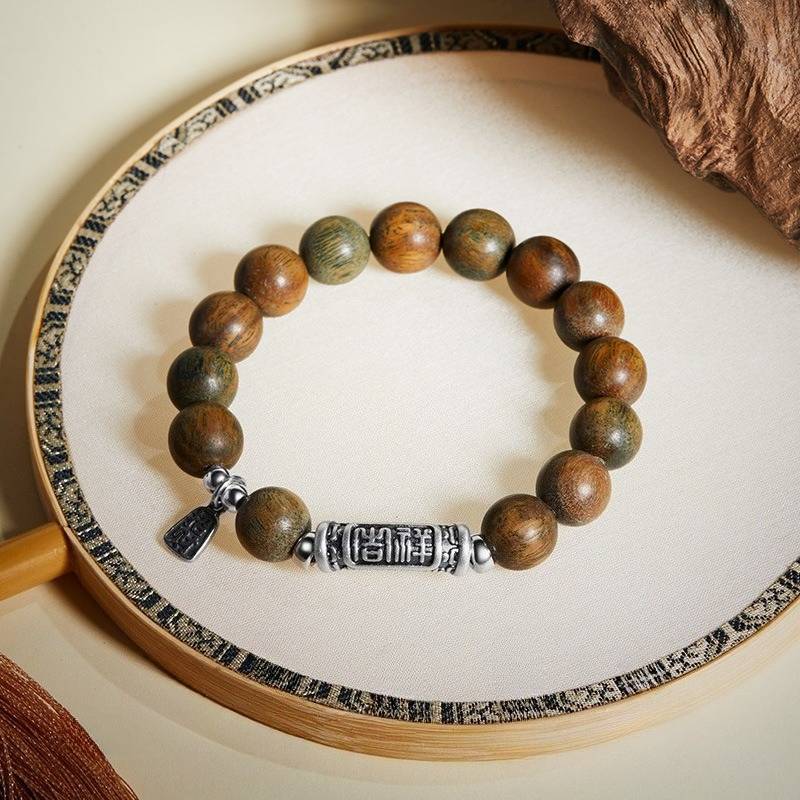 Harmony &amp; Fortune Sandalwood Bracelet With Auspicious Text Charm - top view shot