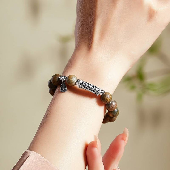Harmony &amp; Fortune Sandalwood Bracelet With Auspicious Text Charm - on-wrist shot