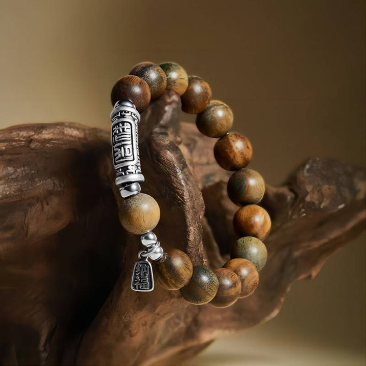 Harmony &amp; Fortune Sandalwood Bracelet With Auspicious Text Charm - prop-styled shot