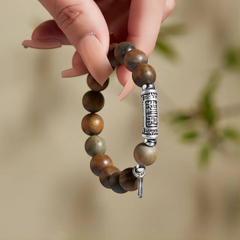 Harmony &amp; Fortune Sandalwood Bracelet With Auspicious Text Charm - on-hand shot