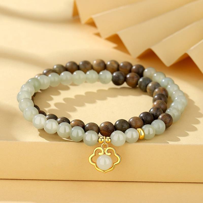 Harmony & Luck Hetian Jade And Sandalwood Bracelet With Ruyi Pendant - prop-styled shot