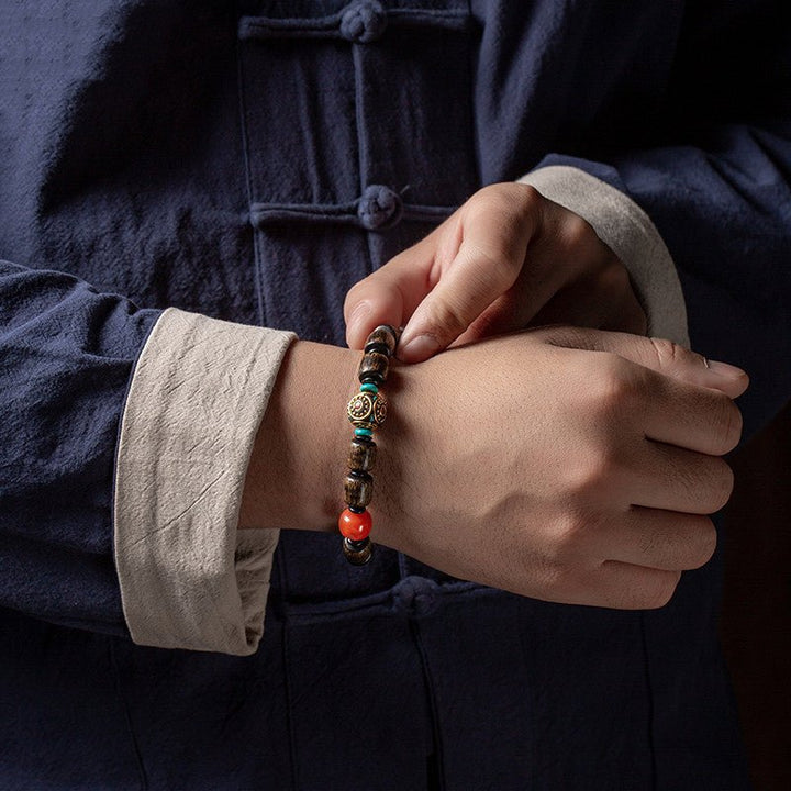 Indonesian Agarwood Barrel Bead Bracelet With Red Agate &amp; Nepal Bead - Calm &amp; Grounded - on wrist