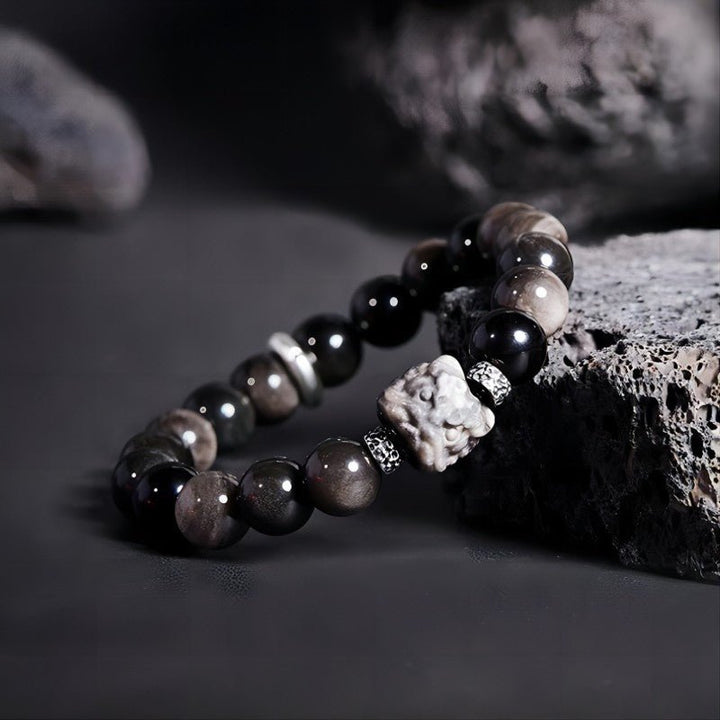 Lion Head Silver Sheen Obsidian Bracelet - Protection &amp; Bold Style - Side view staged shot of golden sheen obsidian bracelet