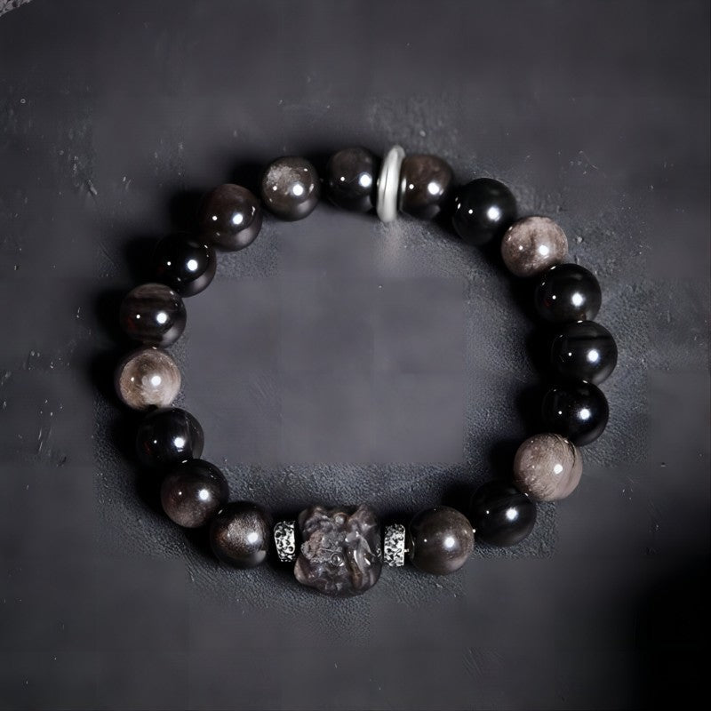 Lion Head Silver Sheen Obsidian Bracelet - Protection & Bold Style - Staged shot of golden sheen obsidian bracelet