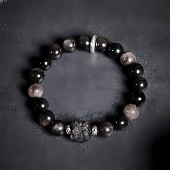 Lion Head Silver Sheen Obsidian Bracelet - Protection &amp; Bold Style - Staged shot of golden sheen obsidian bracelet