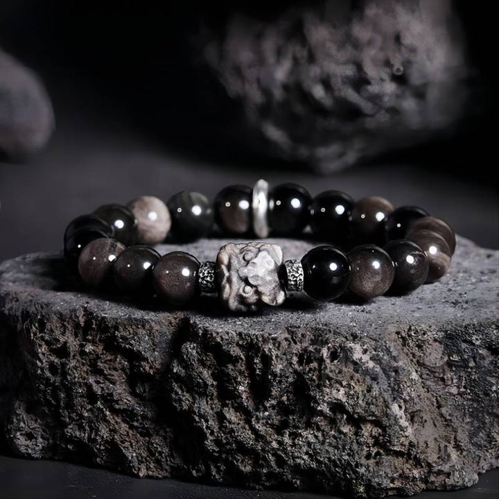 Lion Head Silver Sheen Obsidian Bracelet - Protection &amp; Bold Style - Prop style shot of golden sheen obsidian bracelet