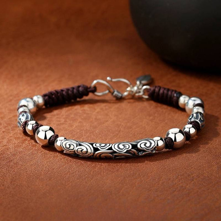 Lucky Cloud Silver Adjustable Braid Cord Bracelet - Harmony &amp; Flow - staged shot