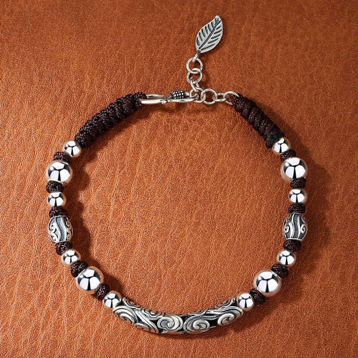 Lucky Cloud Silver Adjustable Braid Cord Bracelet - Harmony &amp; Flow - top view staged shot