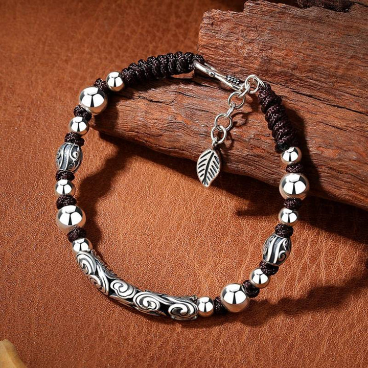Lucky Cloud Silver Adjustable Braid Cord Bracelet - Harmony &amp; Flow - prop-styled shot