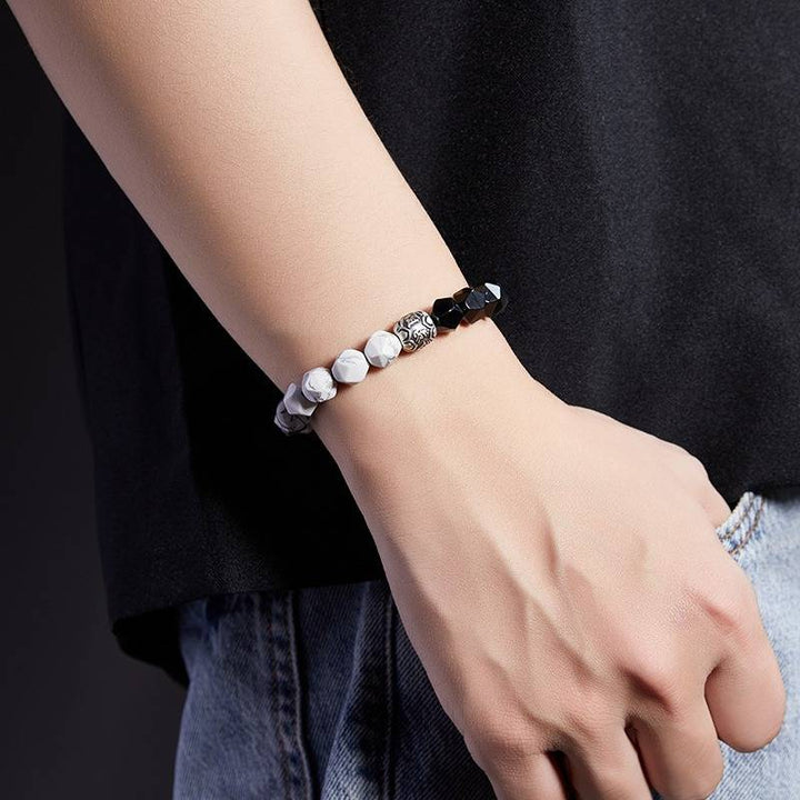 Mantra Blessing Bracelet - On wrist shot of obsidian and sliver diamond-cut beads bracelet