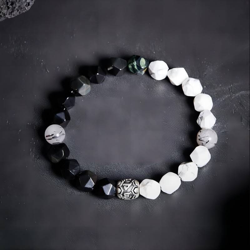 Mantra Blessing Bracelet - Staged shot of obsidian and sliver diamond-cut beads bracelet