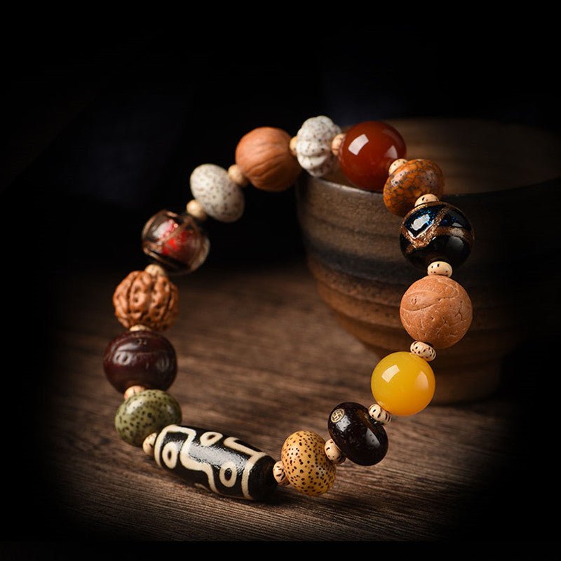 Nine - Eye Dzi & Bodhi Seed Multi - Treasure Bracelet - Protection & Harmony - side view Prop Styling