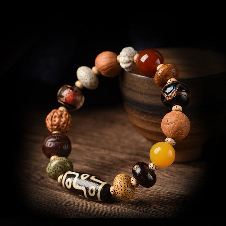 Nine - Eye Dzi &amp; Bodhi Seed Multi - Treasure Bracelet - Protection &amp; Harmony - side view Prop Styling