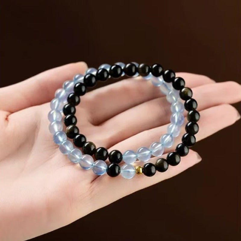 Obsidian &amp; Aquamarine Stackable Guardian Duo Bracelet - Calm &amp; Clarity - top view on-hand shot