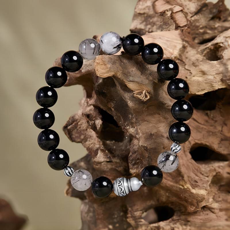 Obsidian Bracelet With Aged Silver Gourd For Fortune & Peace - Prop styling shot