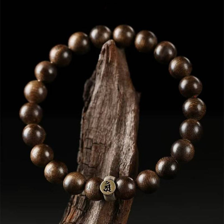 Personal Guardian Sanskrit Zodiac Charm Agarwood Bracelet - Peace &amp; Smooth Fortune - prop-styled shot