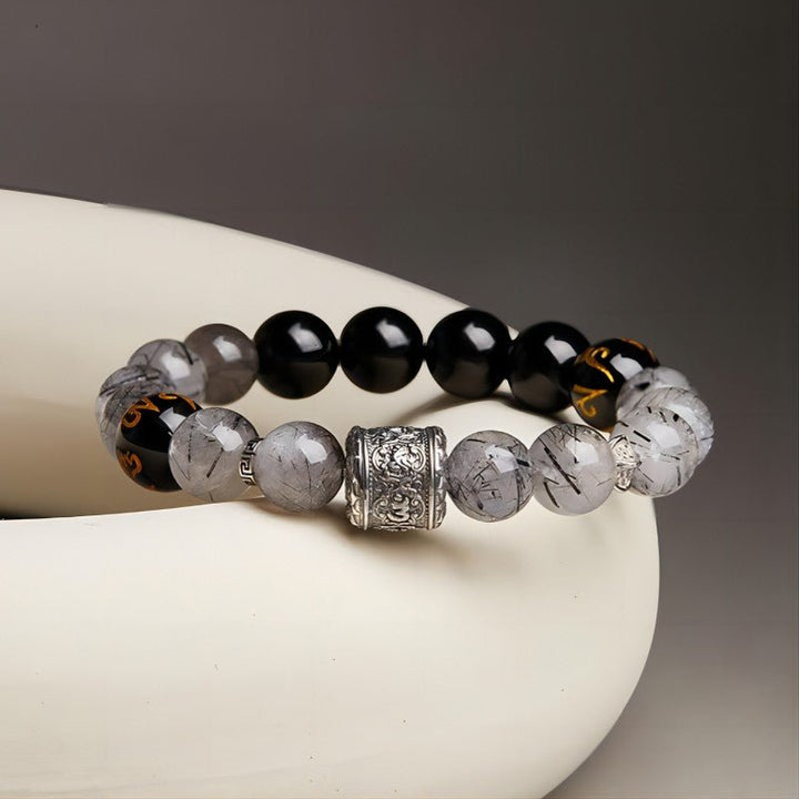 Protection and Blessing Mantra Bead Bracelet - Grounding &amp; Good Fortune - Prop Styling shot of the Black Obsidian bracelet