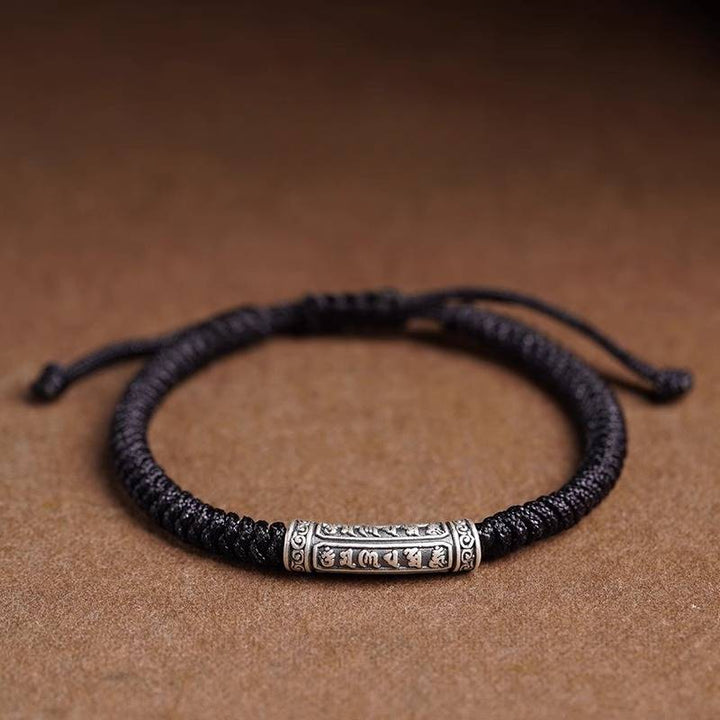 Protection Knot Braided Cord Bracelet - Staged shot of black style with sterling silver charm