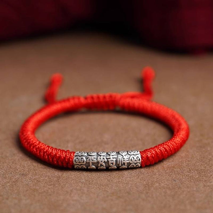 Protection Knot Braided Cord Bracelet - Staged shot of red style with sterling silver charm