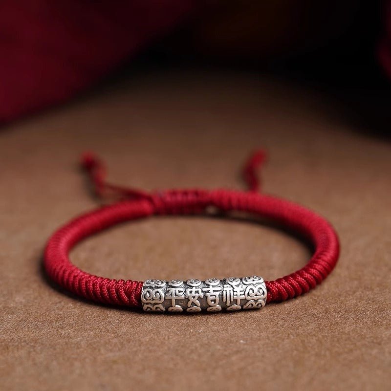 Protection Knot Braided Cord Bracelet - Staged shot of red style with sterling silver charm