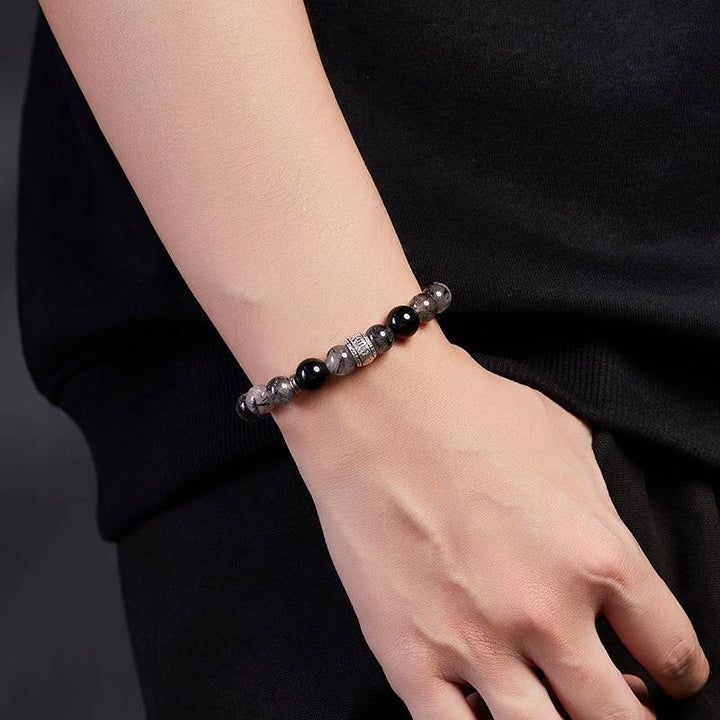 Protection Mantra Bracelet - Abundance &amp; Clarity - On wrist shot of black obsidian and sliver bracelet