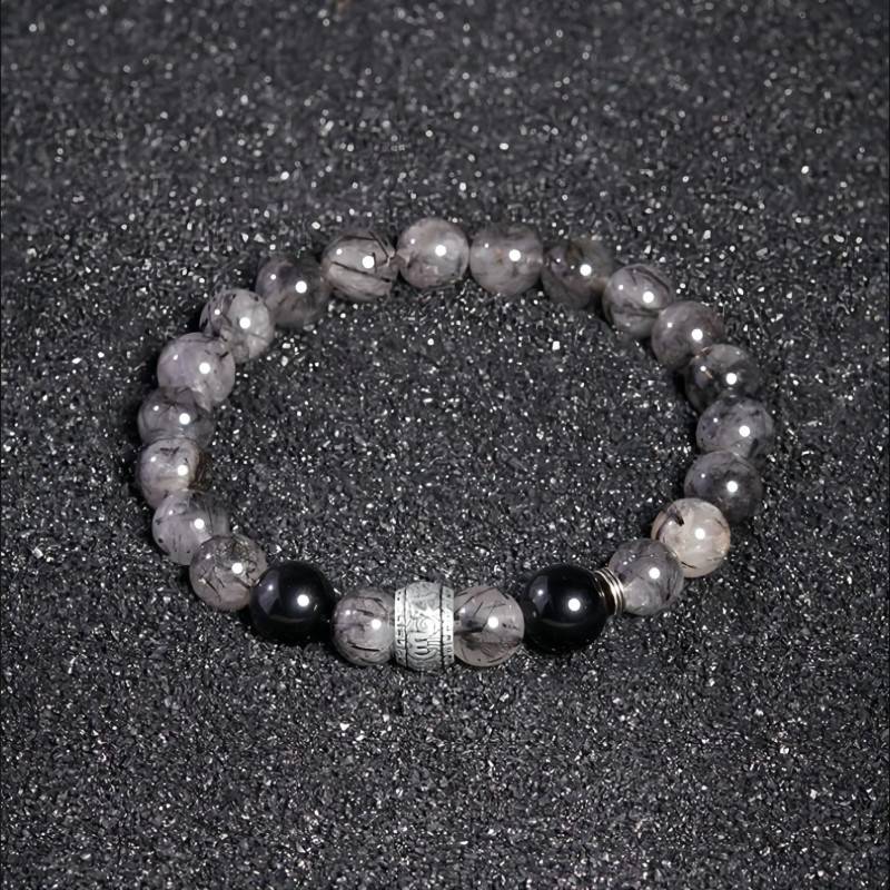 Protection Mantra Bracelet - Abundance & Clarity - Staged shot of black obsidian and sliver bracelet