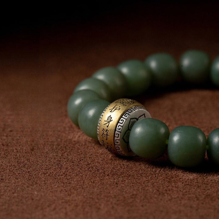 Protection Talisman Drum Hetian Jade Bead Bracelet - Serenity &amp; Safe Passage - close up shot of master bead