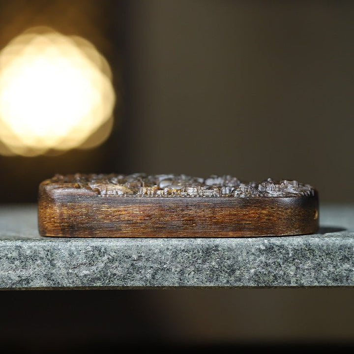 Protective Thousand-Handed Avalokitesvara Pendant - Blessing &amp; Peace - side view of the agarwood pendant