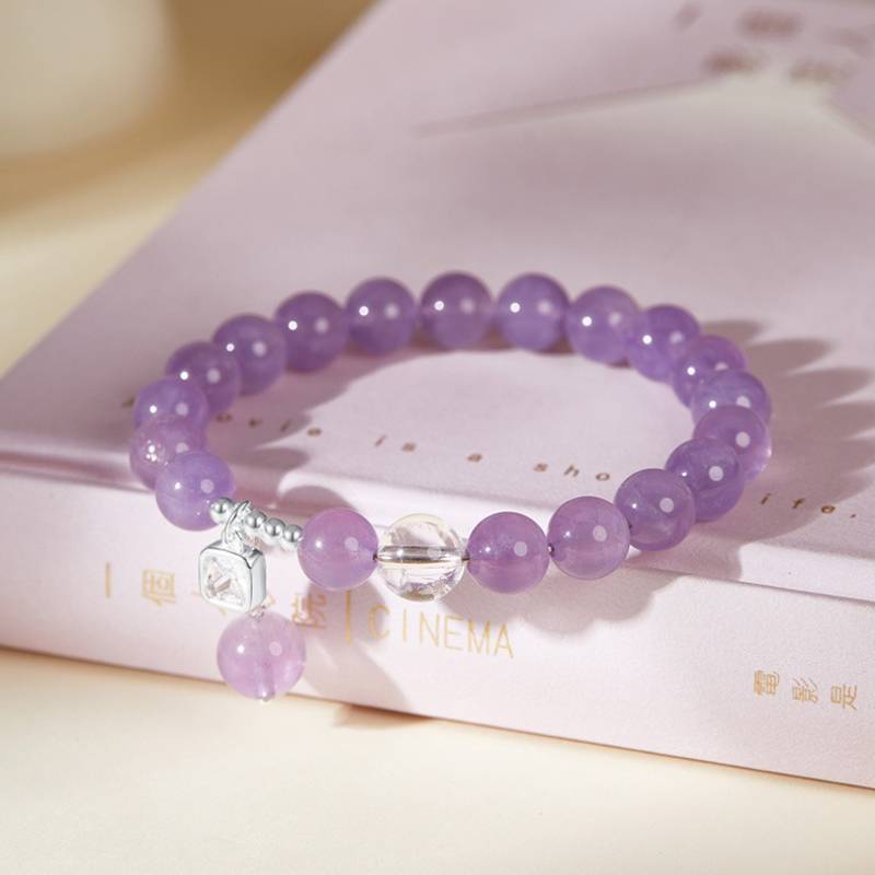 Purple Flame Harmony Amethyst Bracelet With Cubic Zirconia - prop-styled shot focus on white crystal master bead