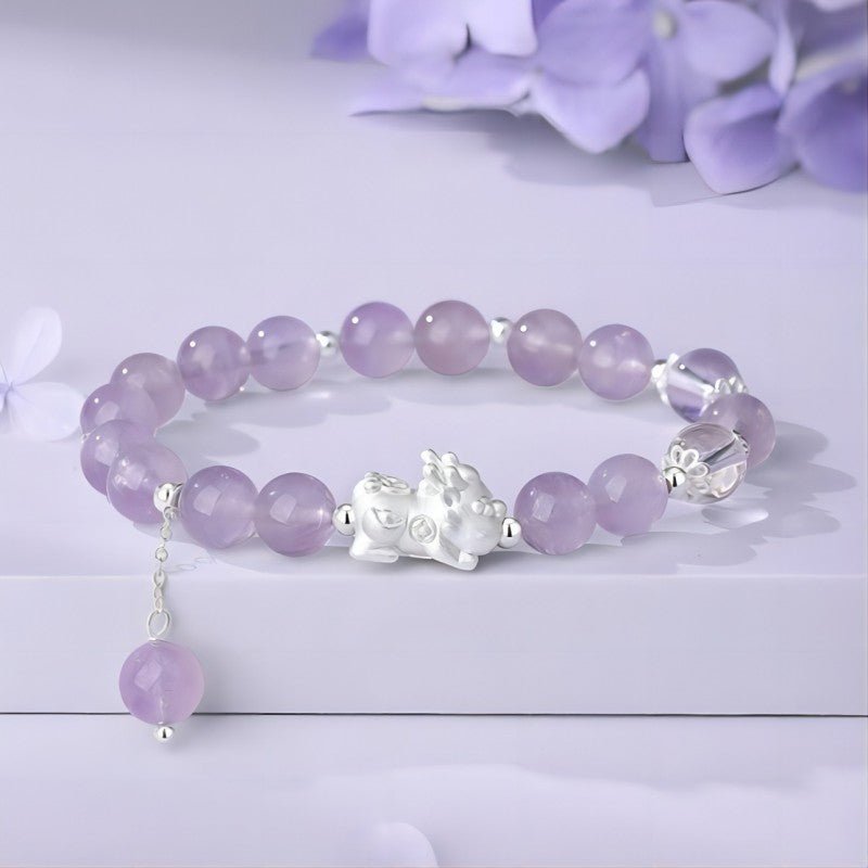 Purple Flame Renewal Amethyst Bracelet With Pixiu Charm - prop-styled shot focus on sterling sliver pixiu