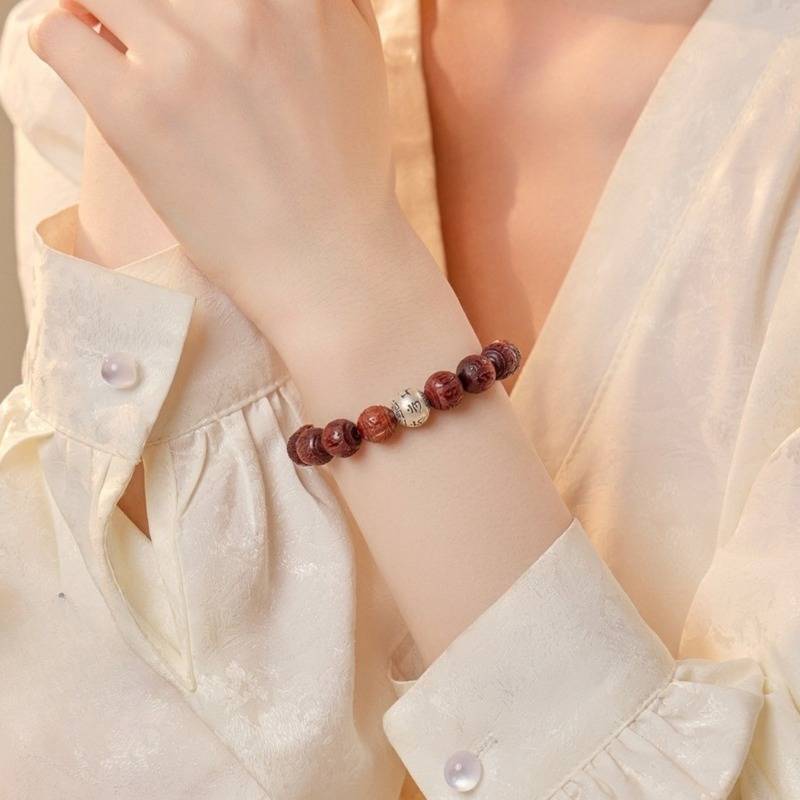 Sacred Mantra Engraved Sandalwood Bracelet - Peace &amp; Smooth Fortune - on-wrist wearing display