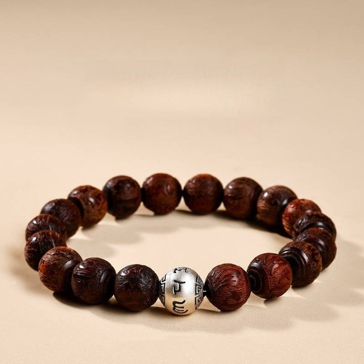 Sacred Mantra Engraved Sandalwood Bracelet - Peace &amp; Smooth Fortune - close-up staged shot