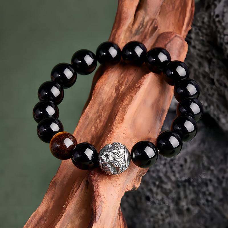 Shadow - Chaser Obsidian Bracelet - Protection • Wealth • Edge - top view prop-styled shot