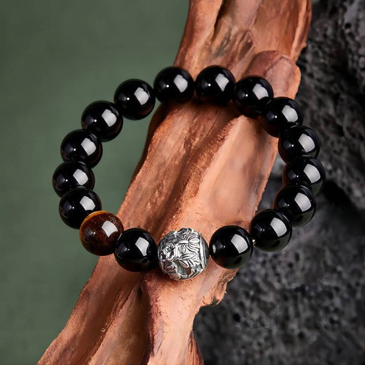 Shadow - Chaser Obsidian Bracelet - Protection • Wealth • Edge - top view prop-styled shot