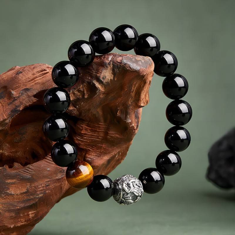 Shadow - Chaser Obsidian Bracelet - Protection • Wealth • Edge - front view prop-styled shot