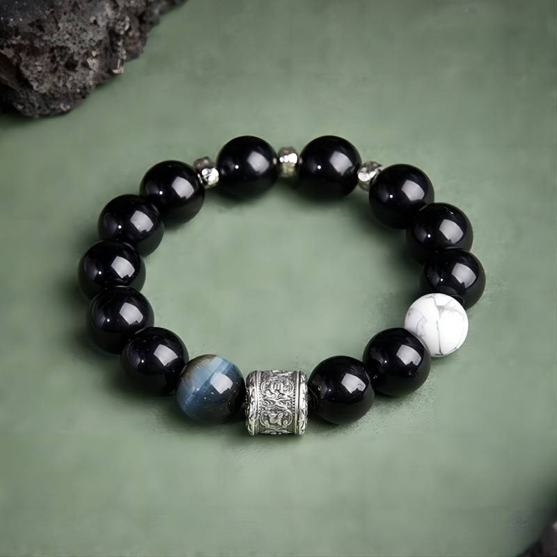 Six Syllable Mantra Bracelet - Protection • Clarity • Grounding - Staged shot of black obsidian bracelet