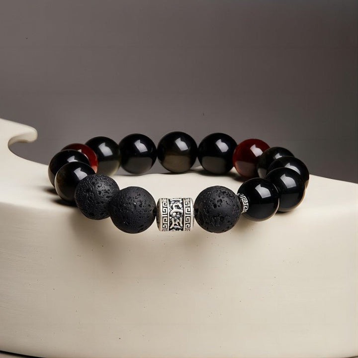 Six Syllable Mantra Bracelet - Protection • Grounding • Vitality - Front view staged shot of black obsidian bracelet