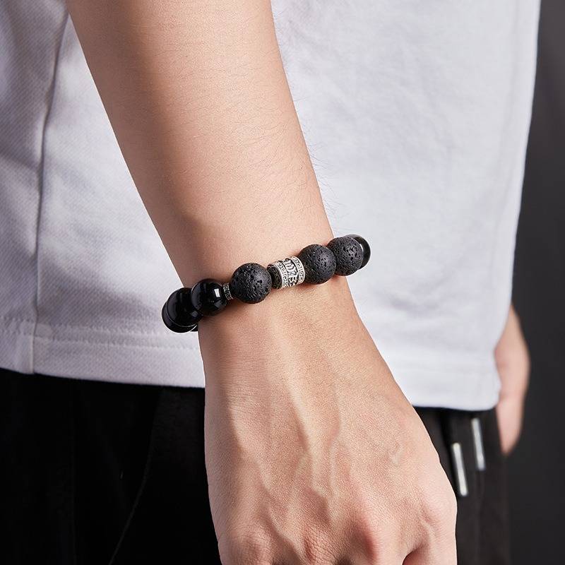 Six Syllable Mantra Bracelet - Protection • Grounding • Vitality - On wrist shot of black obsidian bracelet