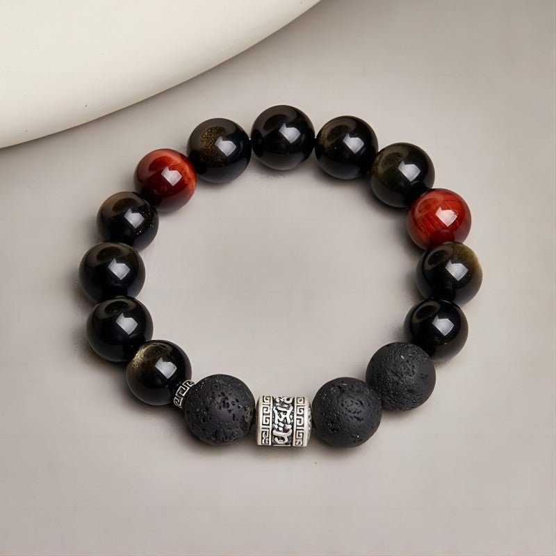 Six Syllable Mantra Bracelet - Protection • Grounding • Vitality - Top view staged shot of black obsidian bracelet