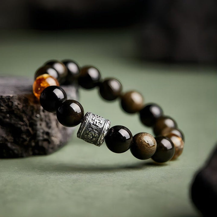 Six - Syllable Mantra Wealth Bracelet - Protection • Clarity -  Side view staged shot of obsidian and citrine bracelet