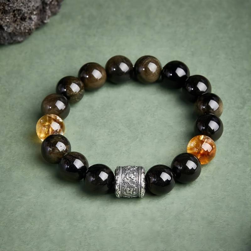 Six - Syllable Mantra Wealth Bracelet - Protection • Clarity -  Staged shot of obsidian and citrine bracelet