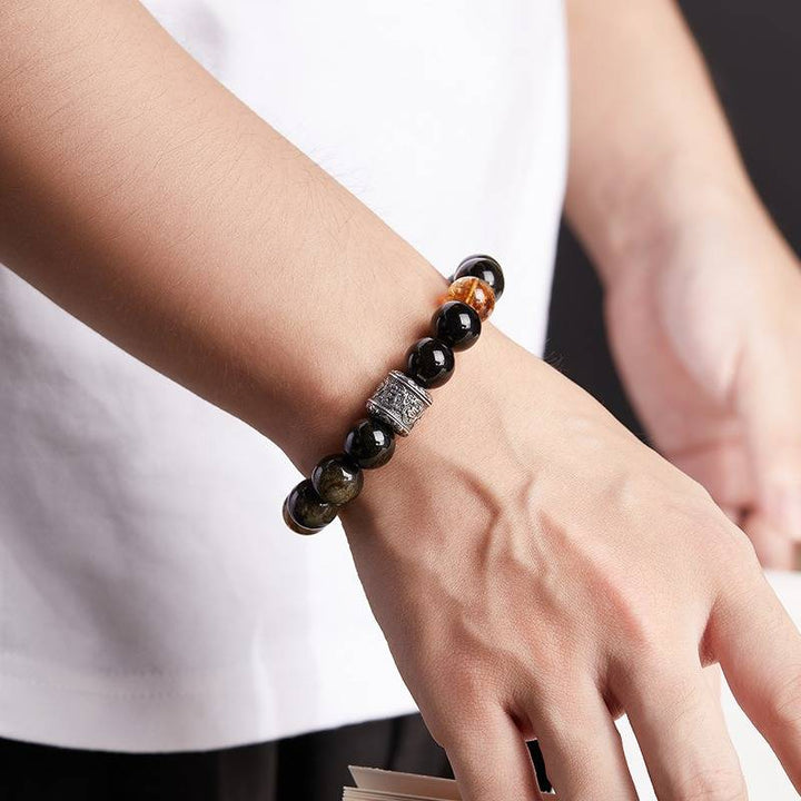 Six - Syllable Mantra Wealth Bracelet - Protection • Clarity -  On wrist shot of obsidian and citrine bracelet