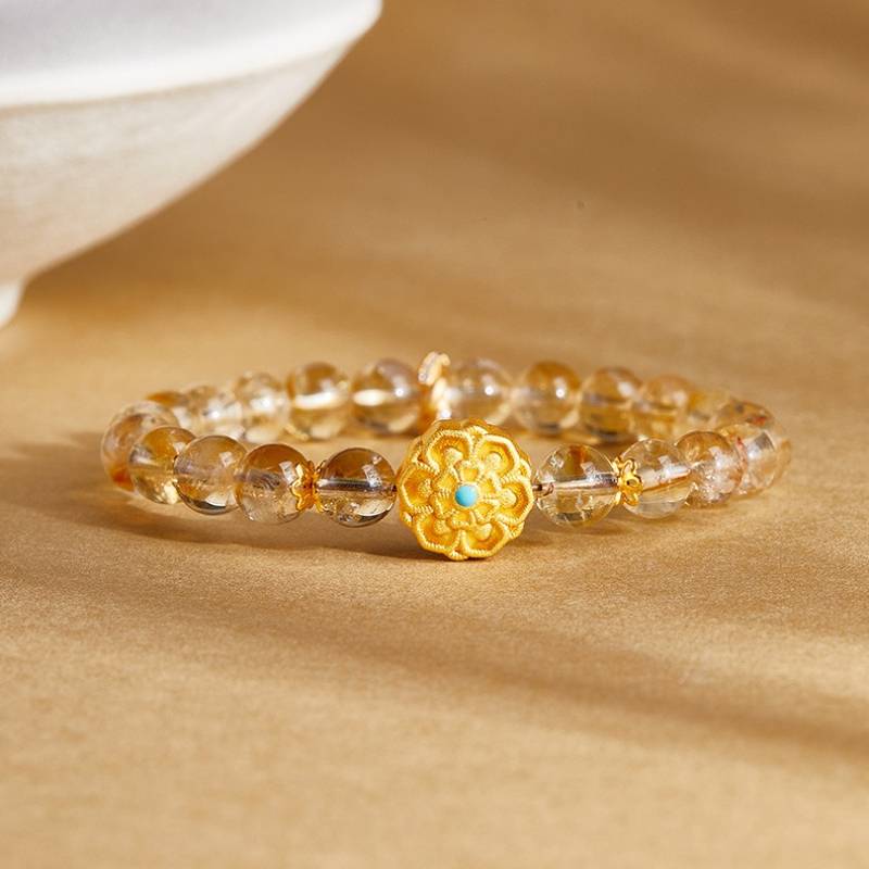 Sunward Prosperity Lotus Citrine Bracelet - Clarity • Growth • Illumination - prop-styled shot focus on sliver master bead