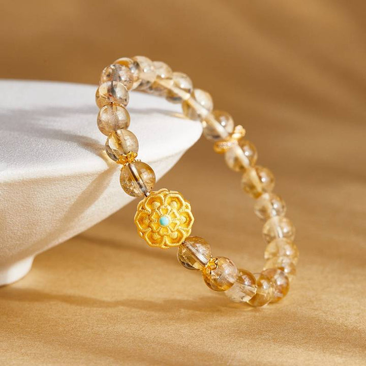 Sunward Prosperity Lotus Citrine Bracelet - Clarity • Growth • Illumination - side view prop-styled shot
