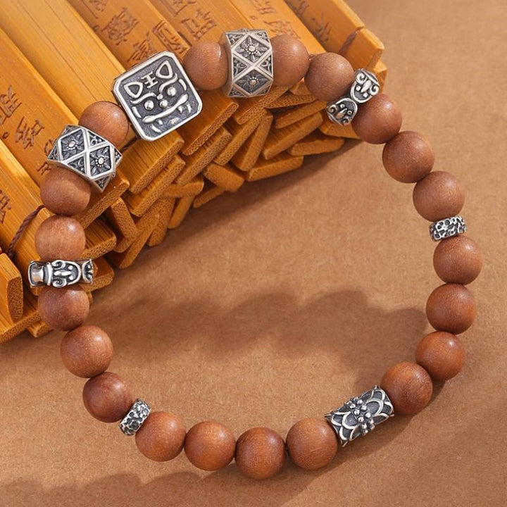 Sterling Sliver Tiger Head Bead Sandalwood Bracelet - Clarity • Protection • Elegance - prop-styled shot 2