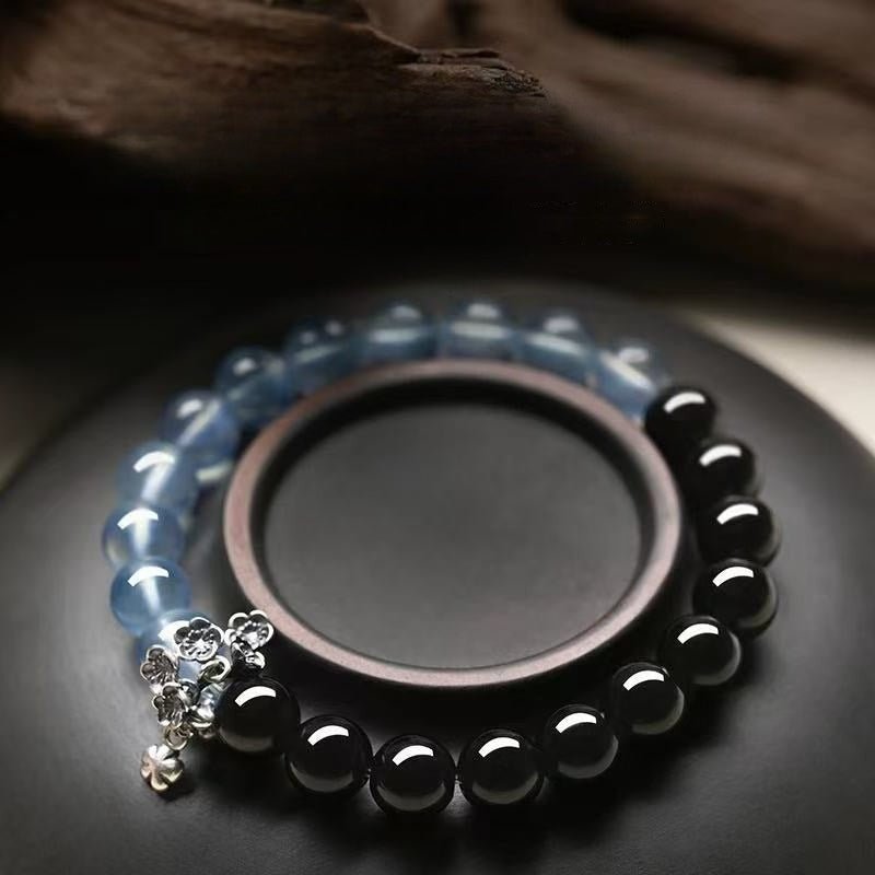 Tranquil Guardian Aquamarine & Obsidian Bracelet - Good Fortune & Serenity - Prop styling shot