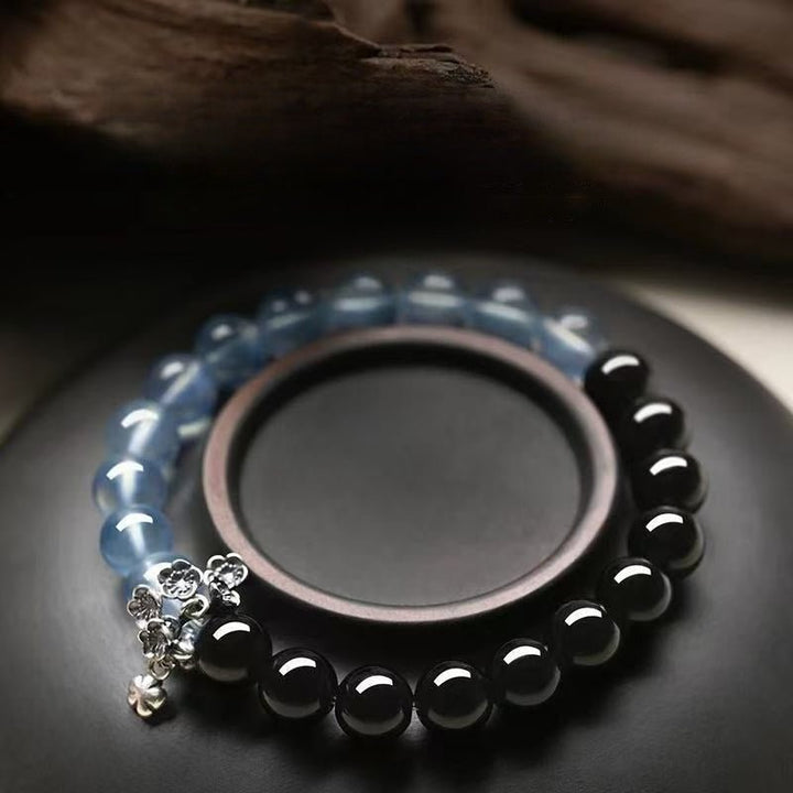 Tranquil Guardian Aquamarine &amp; Obsidian Bracelet - Good Fortune &amp; Serenity - Prop styling shot