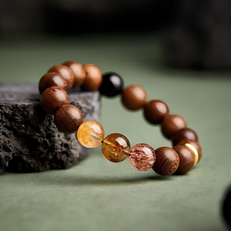 Wealth Flow &amp; Protection Sandalwood And Crystal Bracelet - Clarity • Grounding • Momentum - side view prop-styled shot