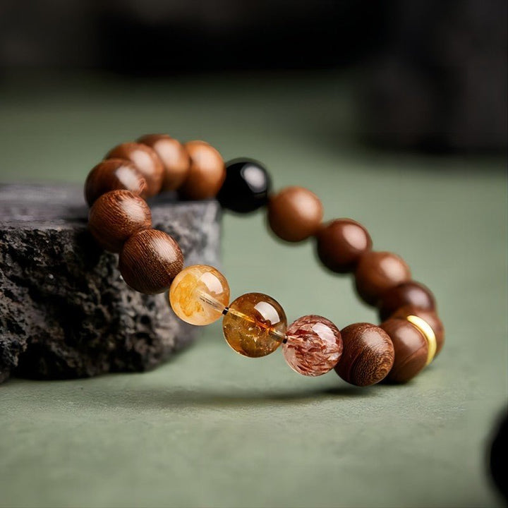Wealth Flow &amp; Protection Sandalwood And Crystal Bracelet - Clarity • Grounding • Momentum - side view prop-styled shot
