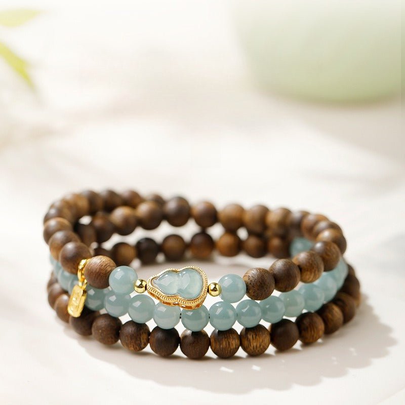 Wealth & Fortune Fu Lu Gourd Pendant Bracelet - Clarity • Calm • Focus - Staged Shot on desk